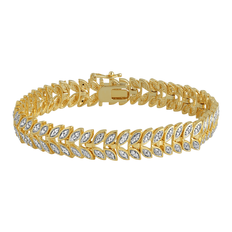 Gold-tone bracelet with diamond-like stones set in a leaf pattern design.