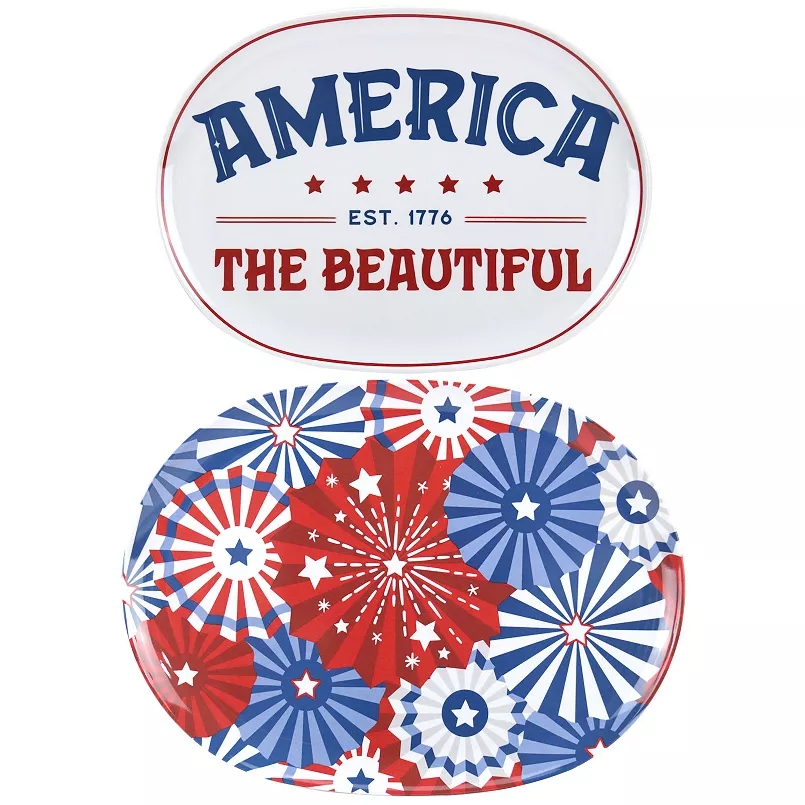 Two oval platters with a patriotic theme: one displaying \“AMERICA THE BEAUTIFUL EST. 1776\“ with stars, and the other featuring red, white, and blue starburst patterns.