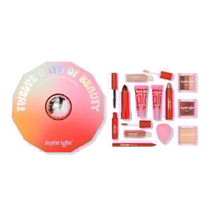 The Ulta Advent Calendar, titled \“Twelve Days of Beauty,\“ contains a variety of cosmetic items such as lip gloss, mascara, eyeshadows, and facial products, presented in a circular pink and red package.