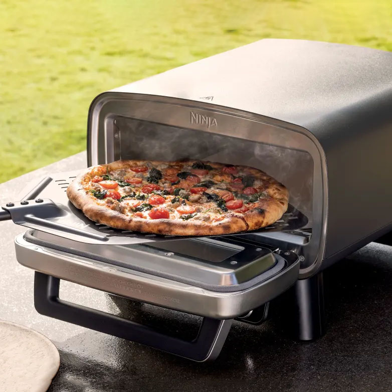 The Ninja Artisan Electric Pizza Oven is a sleek, modern appliance designed to bake pizzas with a stone baking board. It's compact and fits on countertops, featuring a stainless steel finish and a wide opening for easy pizza access.