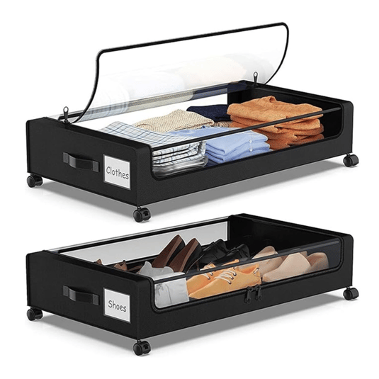 Two rolling under-bed storage bins with transparent lids, one labeled \“Clothes\“ containing folded garments, and the other \“Shoes\“ with various footwear.