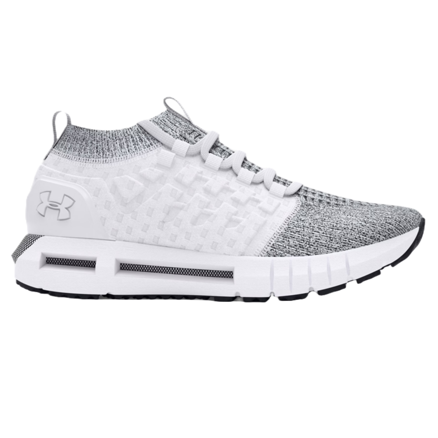 Under Armour Men's Phantom 1 Shoes are knit athletic sneakers featuring a white and gray color scheme with a sock-like ankle collar, lace-up closure, and branded logo on the heel. They have a cushioned sole for comfort and a modern, sleek design.