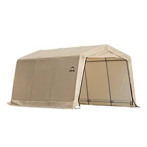 Shelter Logic Instant Garage Carport, tan, with a steel frame and fabric cover, designed for temporary outdoor vehicle storage protection. Includes roll-up door for easy access.