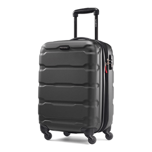 A black hard-shell suitcase with four wheels, a telescopic handle, and a side lock.