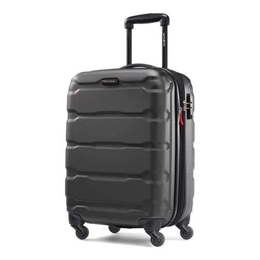 A black hard-shell suitcase with four wheels, a telescopic handle, and a side lock.