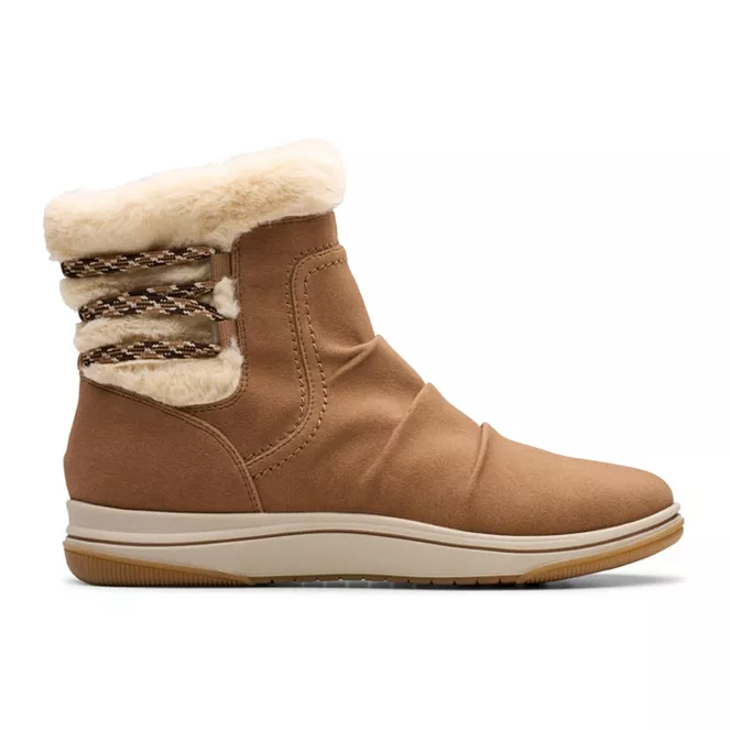 Clarks Cloudsteppers Cozy Boots are tan mid-calf boots featuring a plush faux fur lining and detailing, with a soft, cushioned sole for comfort. The design includes textured bands around the shaft for added style.