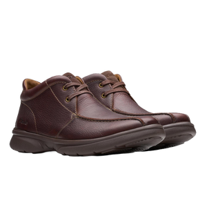 Brown leather lace-up shoes with textured surface and cushioned soles.