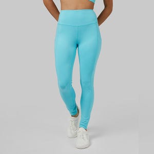 A pair of light blue leggings and white sneakers.