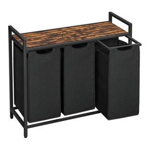 3-section laundry sorter with a black metal frame and wooden top. Each section has a removable fabric bag with handles for easy organization and transport.