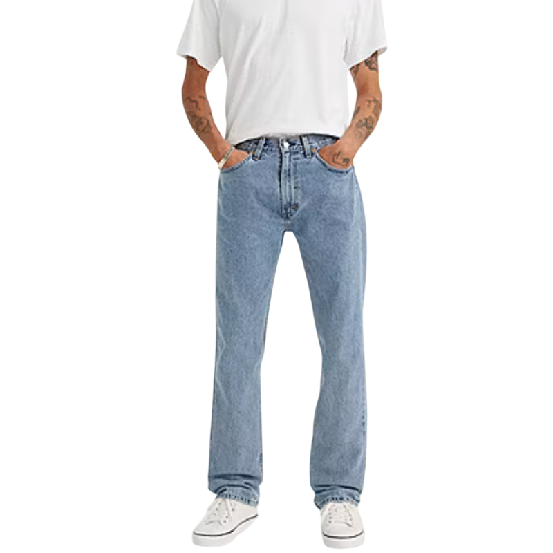A person wearing light blue denim jeans, a white T-shirt, and white sneakers.