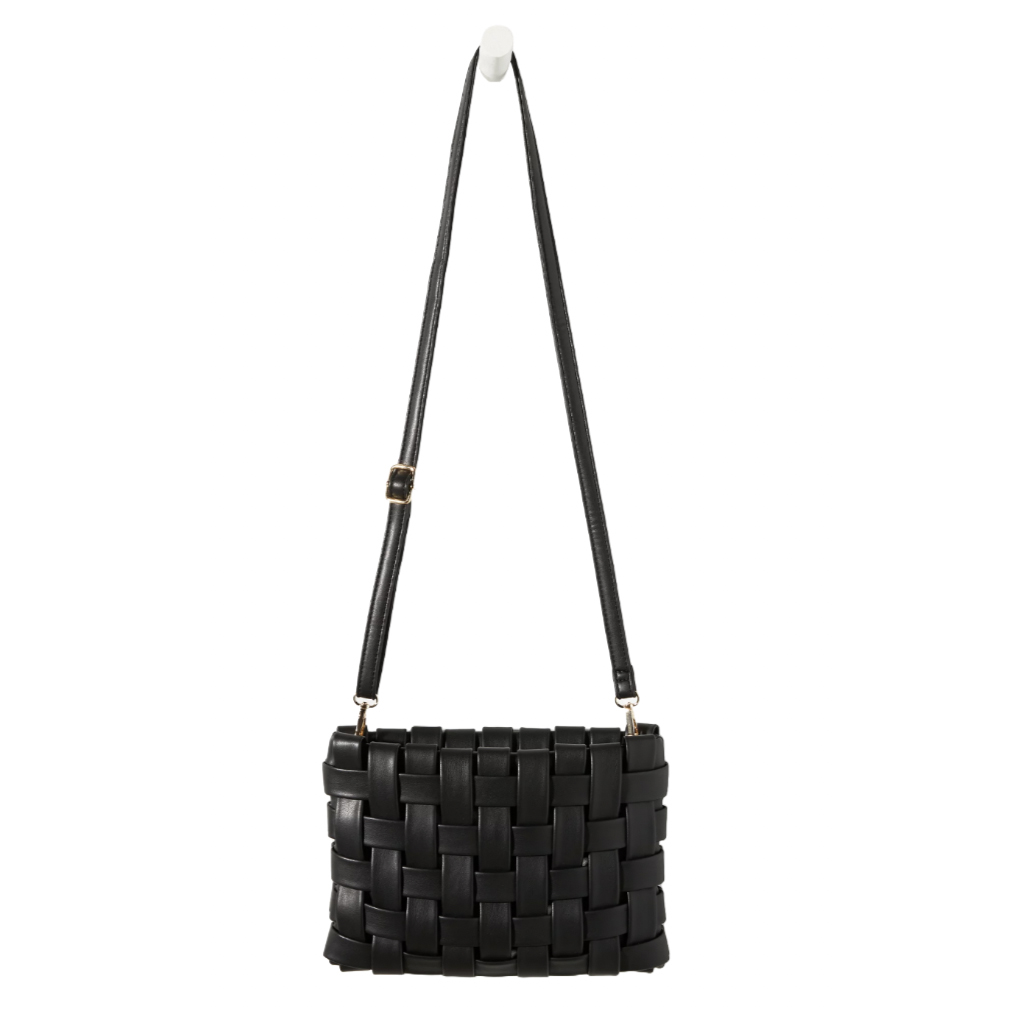 A black woven clutch with an adjustable strap, featuring a grid-like design made from interlaced material. The clutch has metallic hardware connecting the strap to the bag.