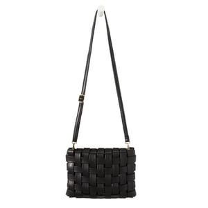 A black woven clutch with an adjustable strap, featuring a grid-like design made from interlaced material. The clutch has metallic hardware connecting the strap to the bag.