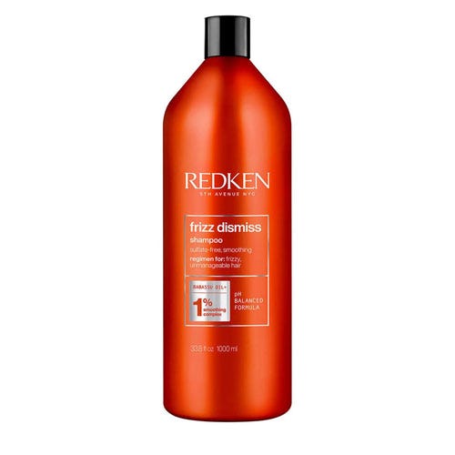 Redken Frizz Dismiss Shampoo with Babassu oil, 1000 ml bottle, designed for anti-frizz and smoothing benefits for unmanageable hair.