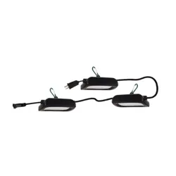 A set of three black LED utility lights connected by a cord with a plug on one end. Each light features a green carabiner for hanging.