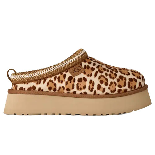 A leopard print UGG slipper with a thick beige platform sole and a decorative woven trim.