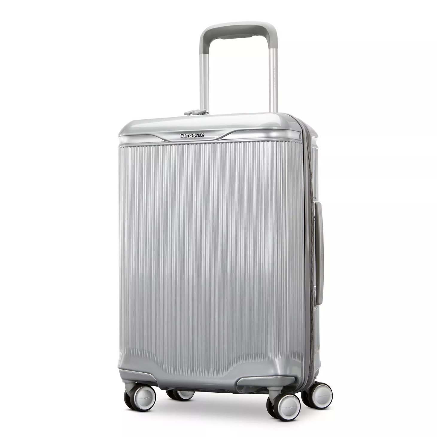 A silver, hard-shell suitcase with a telescopic handle and four double-spinner wheels, designed for easy maneuverability.