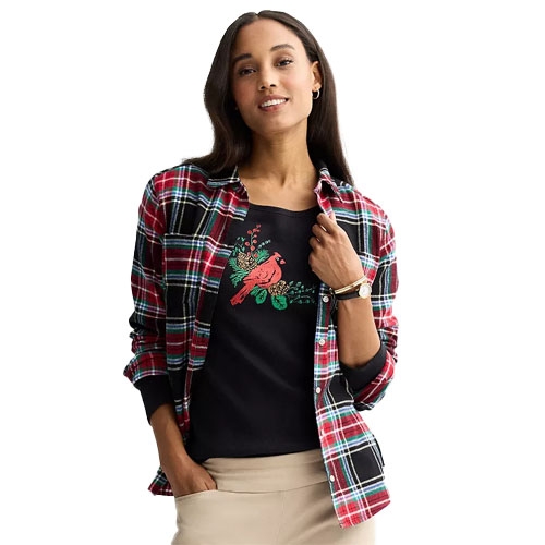 Woman wearing a red plaid shirt over a black T-shirt with a red bird design, paired with beige pants.