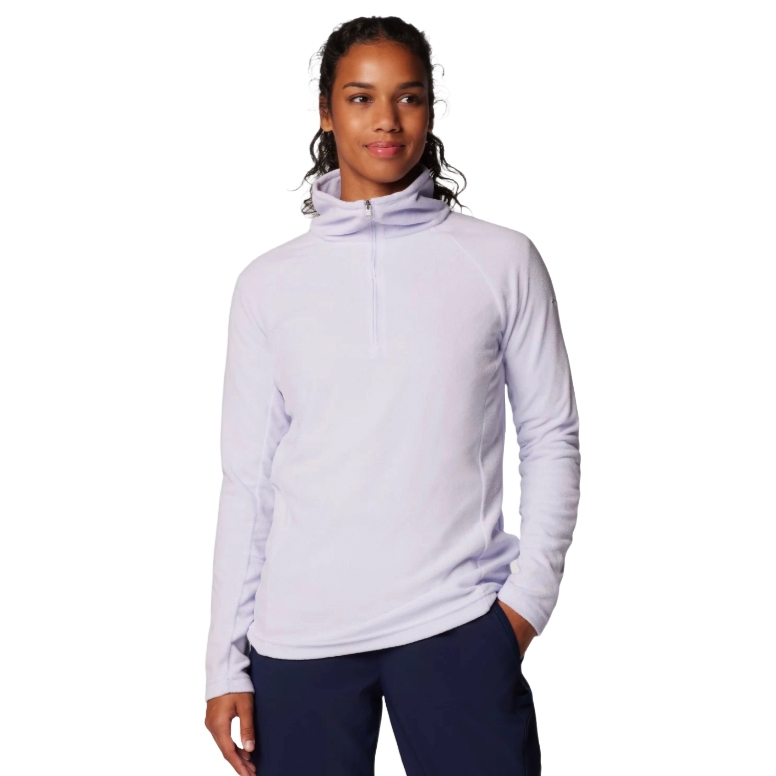 A person wearing a light purple zip-up pullover fleece with long sleeves and dark blue pants, featuring a high collar and relaxed fit.