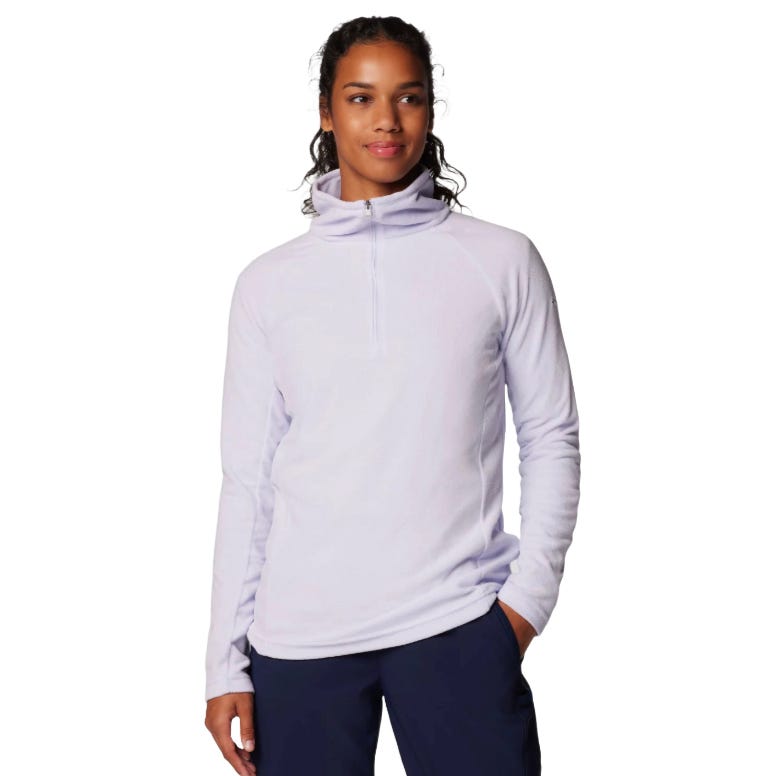 A person wearing a light purple zip-up pullover fleece with long sleeves and dark blue pants, featuring a high collar and relaxed fit.