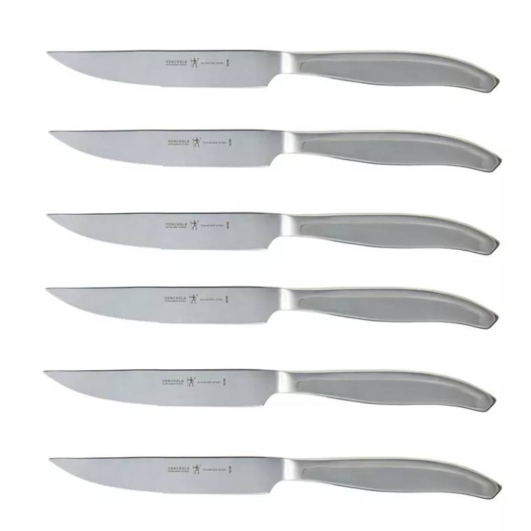 A set of six stainless steel steak knives with serrated blades, featuring sleek, modern handles.