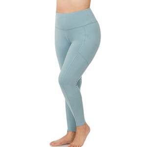 A person is wearing light blue high-waisted leggings.