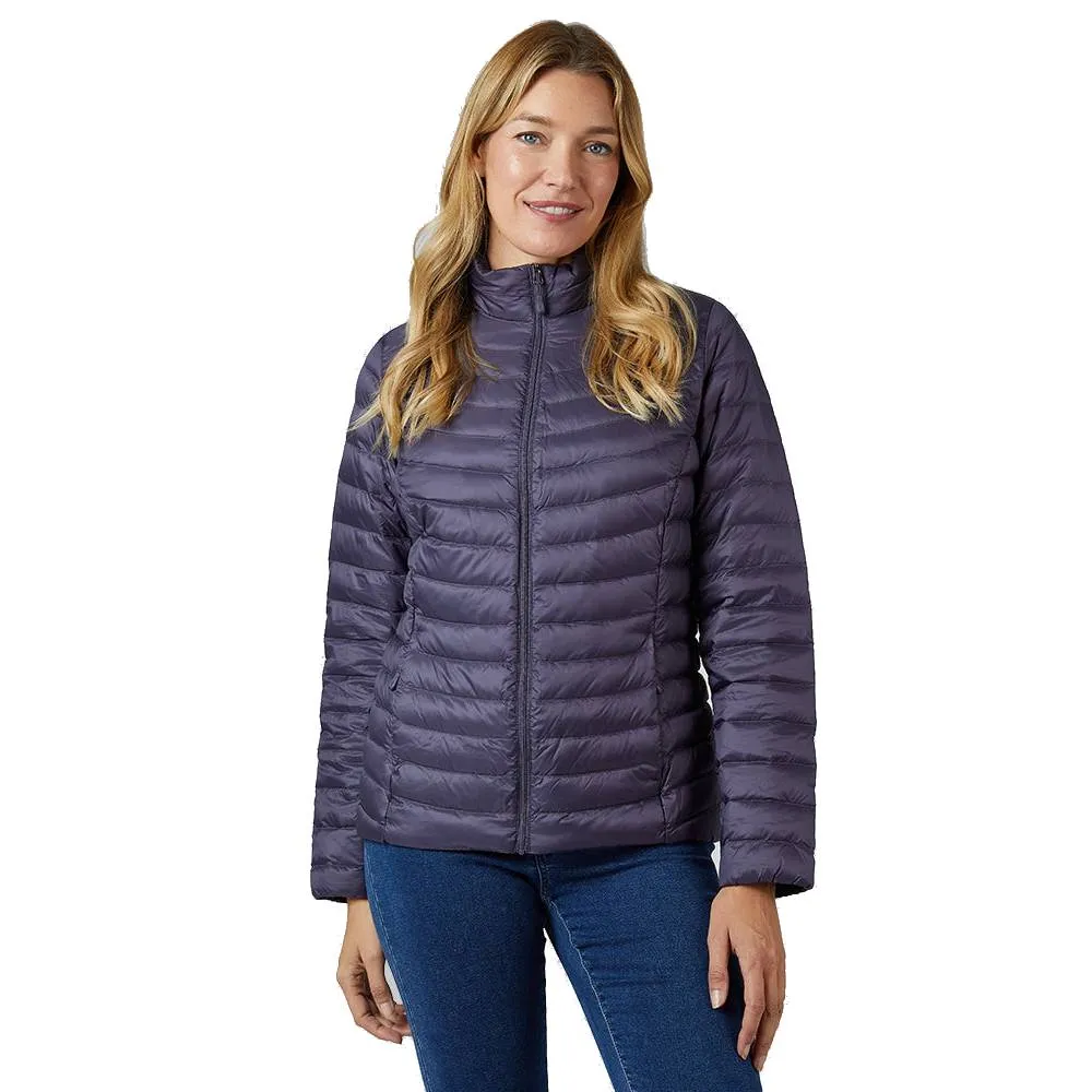 A woman is wearing a purple, quilted puffer jacket with a high collar and full zip closure, paired with blue jeans.