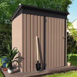 A brown metal shed with a flat black roof, alongside a shovel, a potted plant, and a hose reel.
