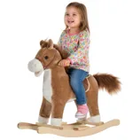 A child rides a plush rocking horse with a wooden base, wearing a colorful floral shirt, blue jeans, and pink sneakers.