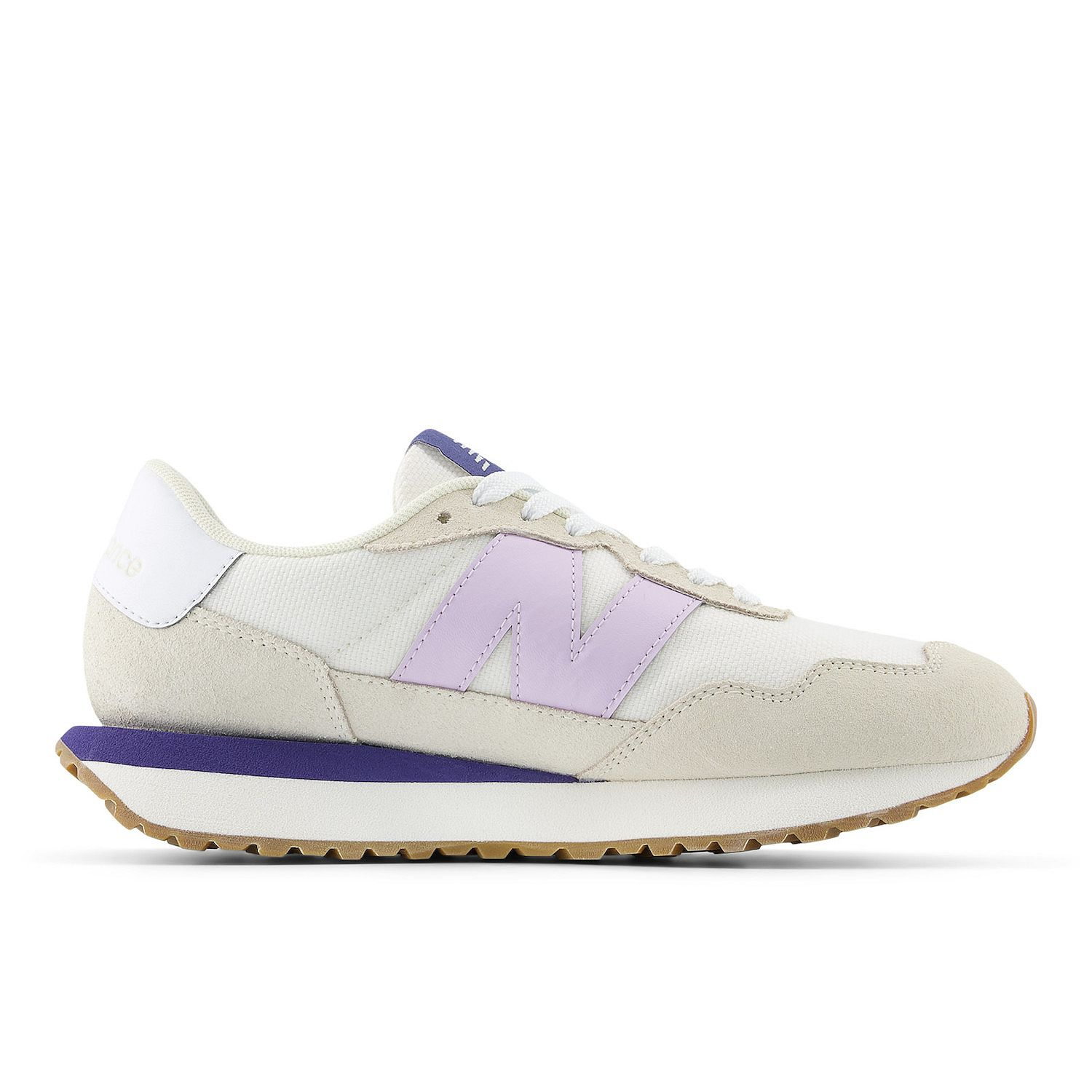 Cream and purple New Balance sneaker with a suede toe, gum sole, and the brand's signature \“N\“ logo on the side.