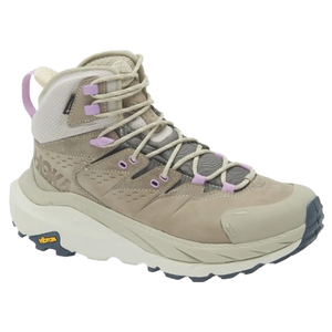 Hoka Kaha Waterproof Hiking Boots in beige feature a high-top design with purple accents, a durable Vibram sole for traction, and mesh panels for breathability, providing support and stability for various terrains.