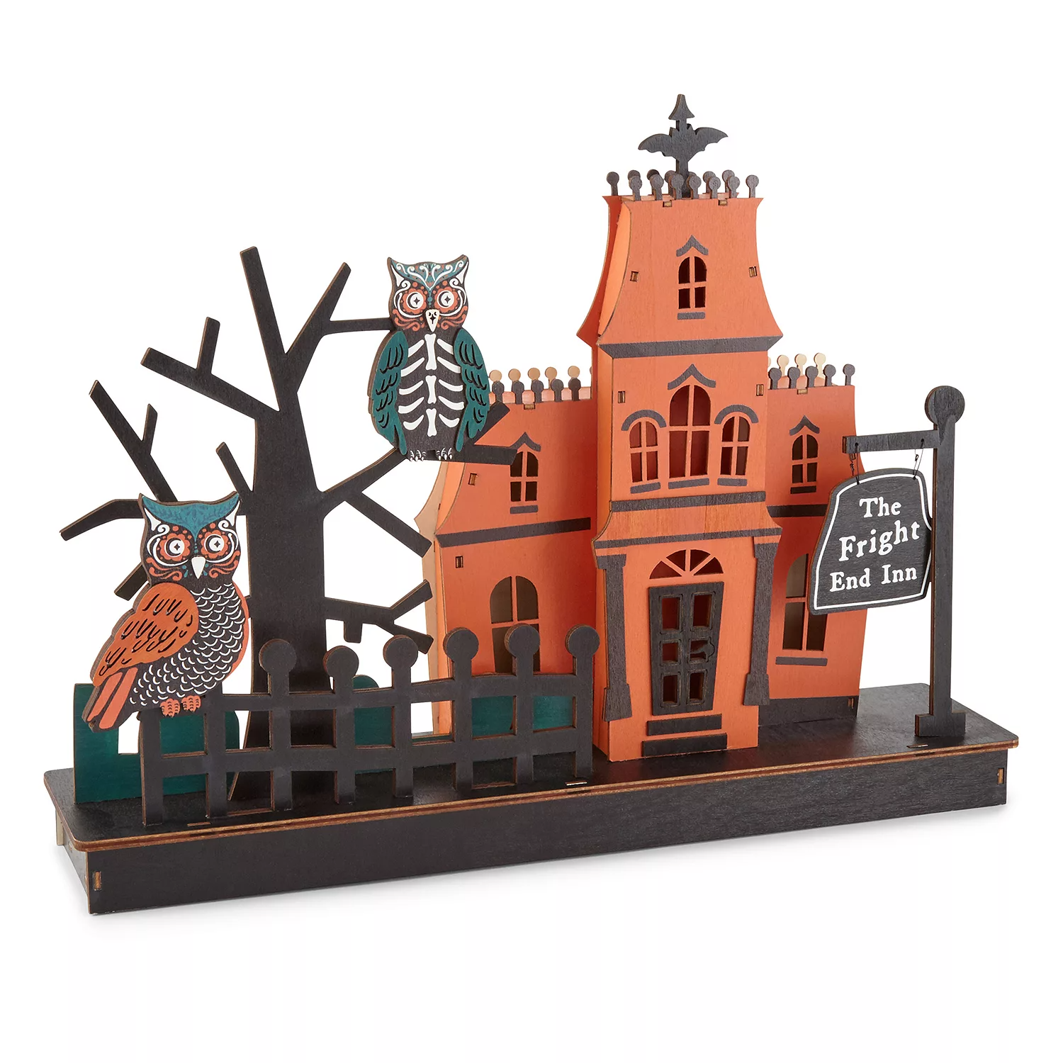 Decorative Halloween house with two owls on a tree and a sign reading \“The Fright End Inn.\“