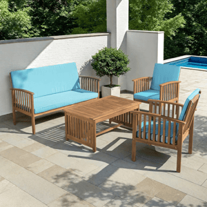 Outdoor patio set with wooden frame features a sofa, two chairs, and a coffee table, all with blue cushions.