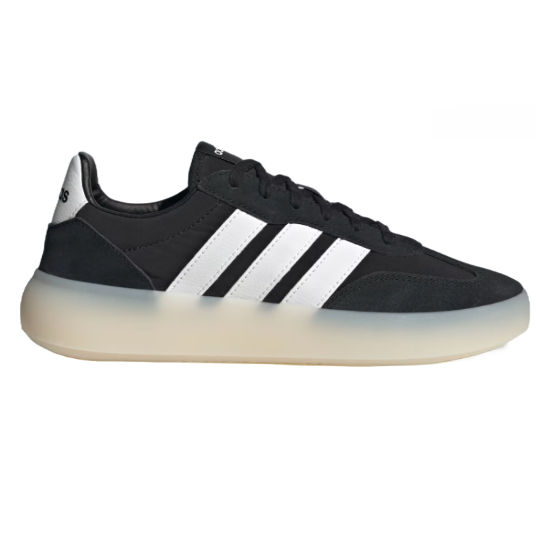 Adidas Barreda Decode Shoes feature a sleek black design with white signature stripes and a translucent sole. They combine classic and modern aesthetics for versatile streetwear style.