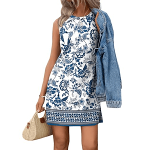 A sleeveless white dress with blue floral patterns, paired with a denim jacket and a straw handbag.
