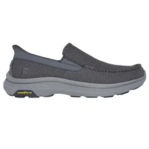 Gray slip-on shoe with a textured upper, featuring a Goodyear-branded sole and a supportive design.