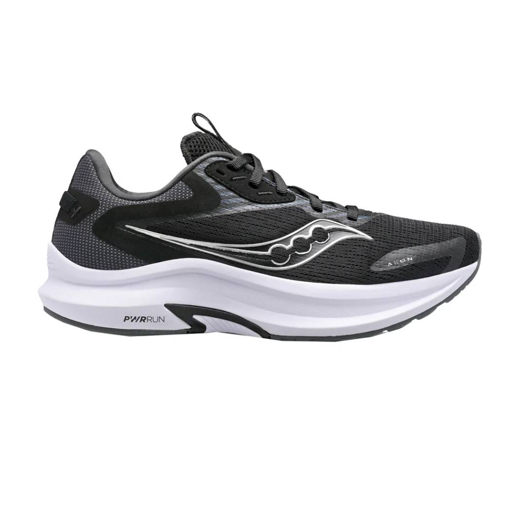Black and white Saucony Axon 2 running shoes featuring a mesh upper for breathability, a curvy logo design on the sides, and a thick, white midsole labeled PWRUN.
