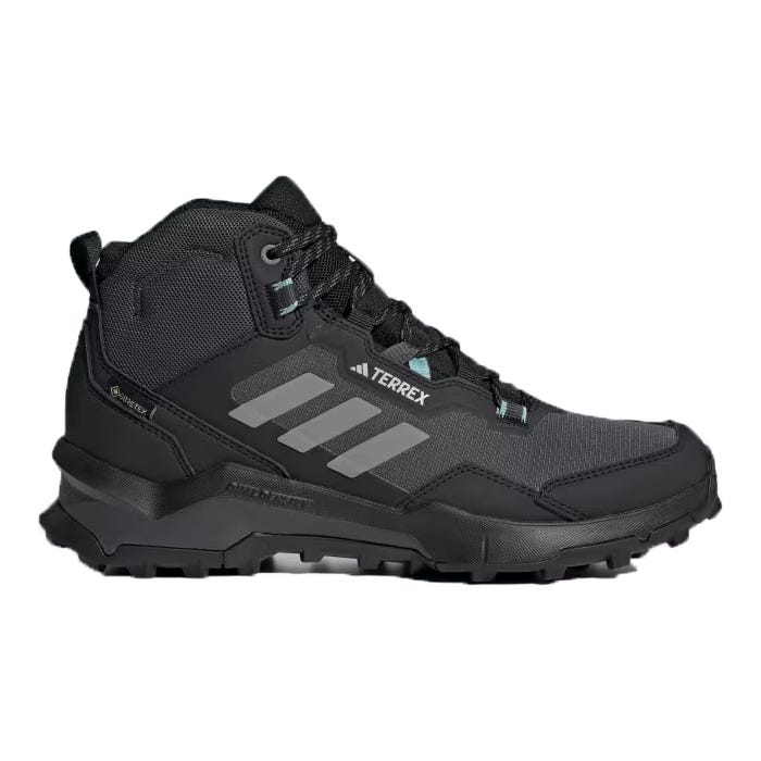 Black high-top Adidas Terrex hiking boots with grey stripes and laces, featuring ankle support and reinforced toe protection.