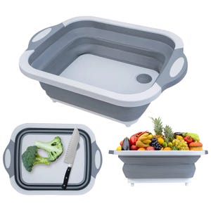 Collapsible cutting board with a drainage hole, also functions as a wash basin and storage for fruits and vegetables. Includes a knife and features a white and gray design.