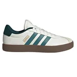 Adidas sneaker in white with green stripes, a brown sole, and a subtle gold logo on the side.