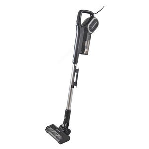 A black-and-silver Farberware Corded Stick Vacuum with a handle, sleek design, and visible dustbin, featuring a powered floor head and compact frame for easy maneuvering.