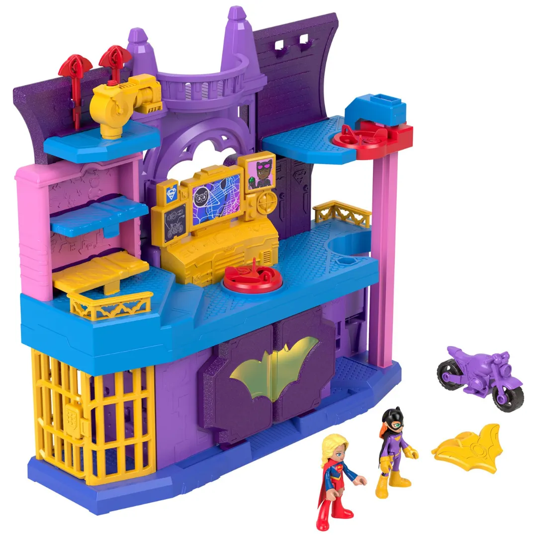 A colorful playset featuring a superhero-themed base, complete with a bat symbol, multiple levels, a control center, prison cell, and accessories like a purple motorcycle. Also includes two superhero figures and a yellow bat-shaped accessory.