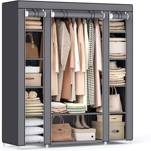 A spacious, black wardrobe featuring multiple compartments with hanging spaces, shelves, and drawers, neatly organized with clothing, handbags, and accessories.
