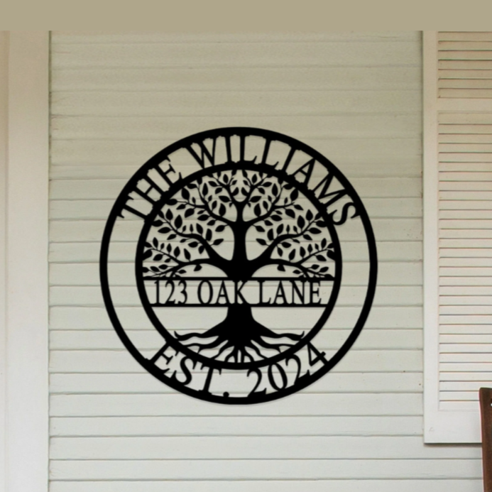 A decorative wall sign is displayed with a tree design and the text \“The Williams, 123 Oak Lane, Est. 2024\“ on a home's exterior wall.