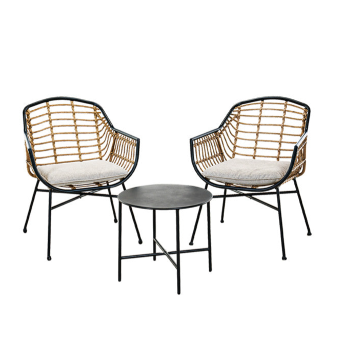 A bistro set featuring two wicker chairs with metal frames and cushions, paired with a round black metal side table.