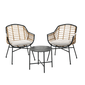 A bistro set featuring two wicker chairs with metal frames and cushions, paired with a round black metal side table.
