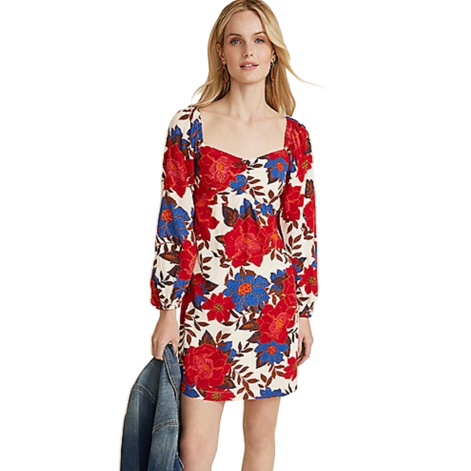 A woman is wearing a form-fitting, knee-length floral dress with long sleeves, square neckline, and a pattern of large red and blue flowers on a white background.
