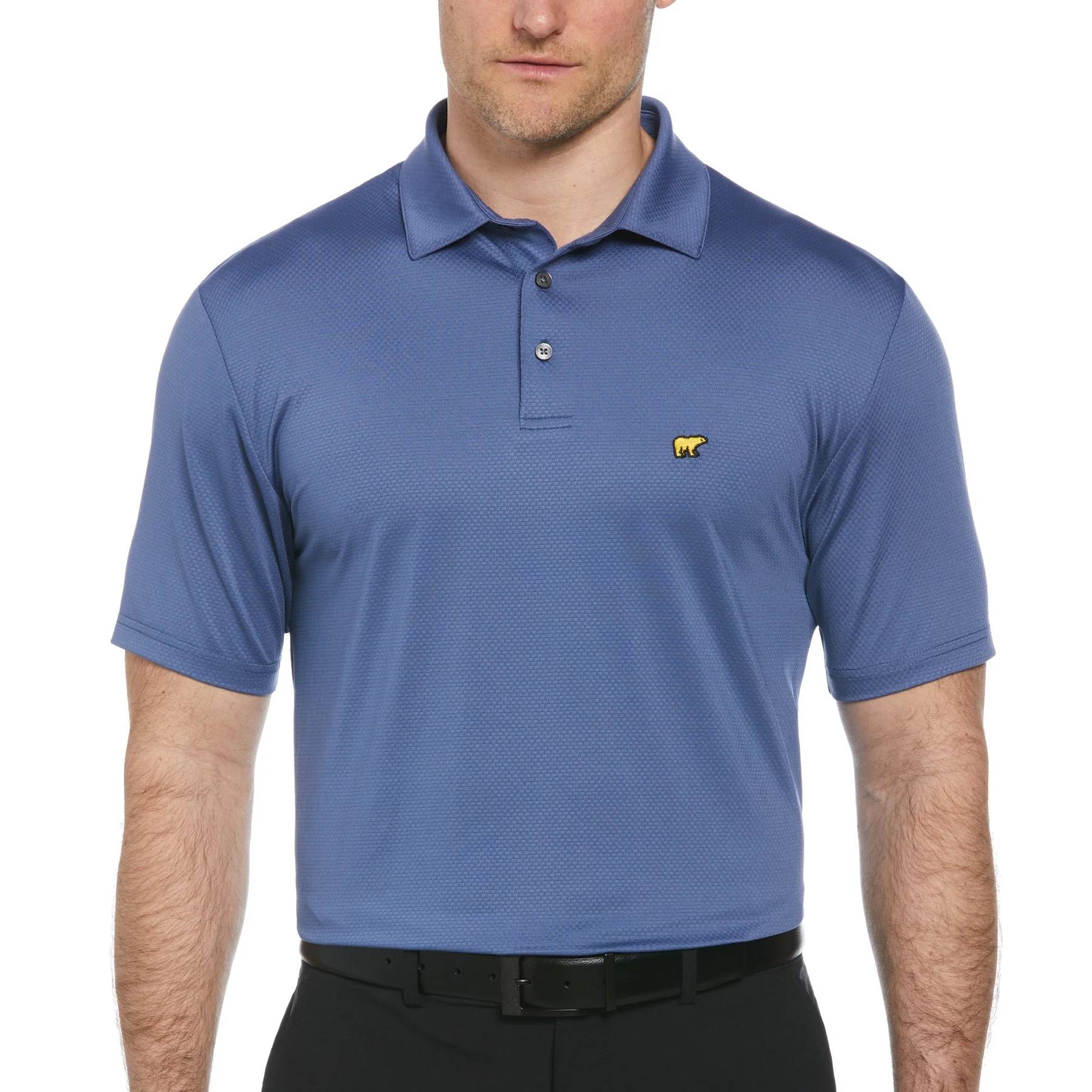 A blue polo shirt with a yellow bear logo on the chest, worn by a man in black pants.