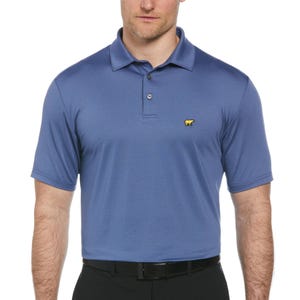 A blue polo shirt with a yellow bear logo on the chest, worn by a man in black pants.