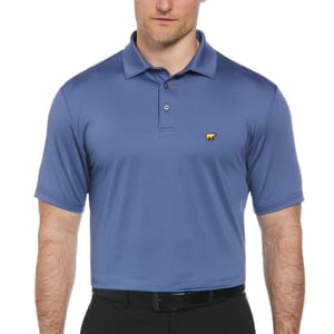 A blue polo shirt with a yellow bear logo on the chest, worn by a man in black pants.