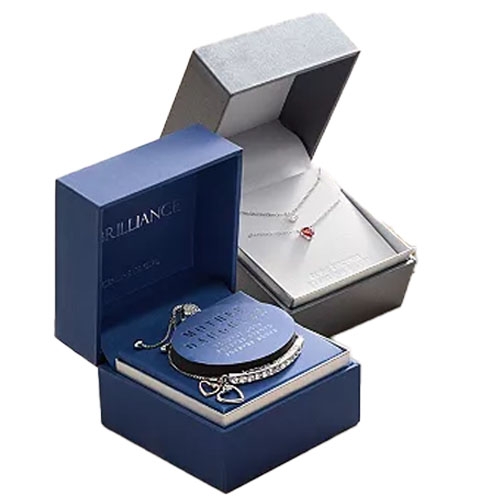 Two jewelry boxes, one in blue containing a bracelet, and the other in gray featuring a necklace with a small red stone pendant.